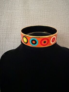 Hermes gold enamel bracelet with orange base